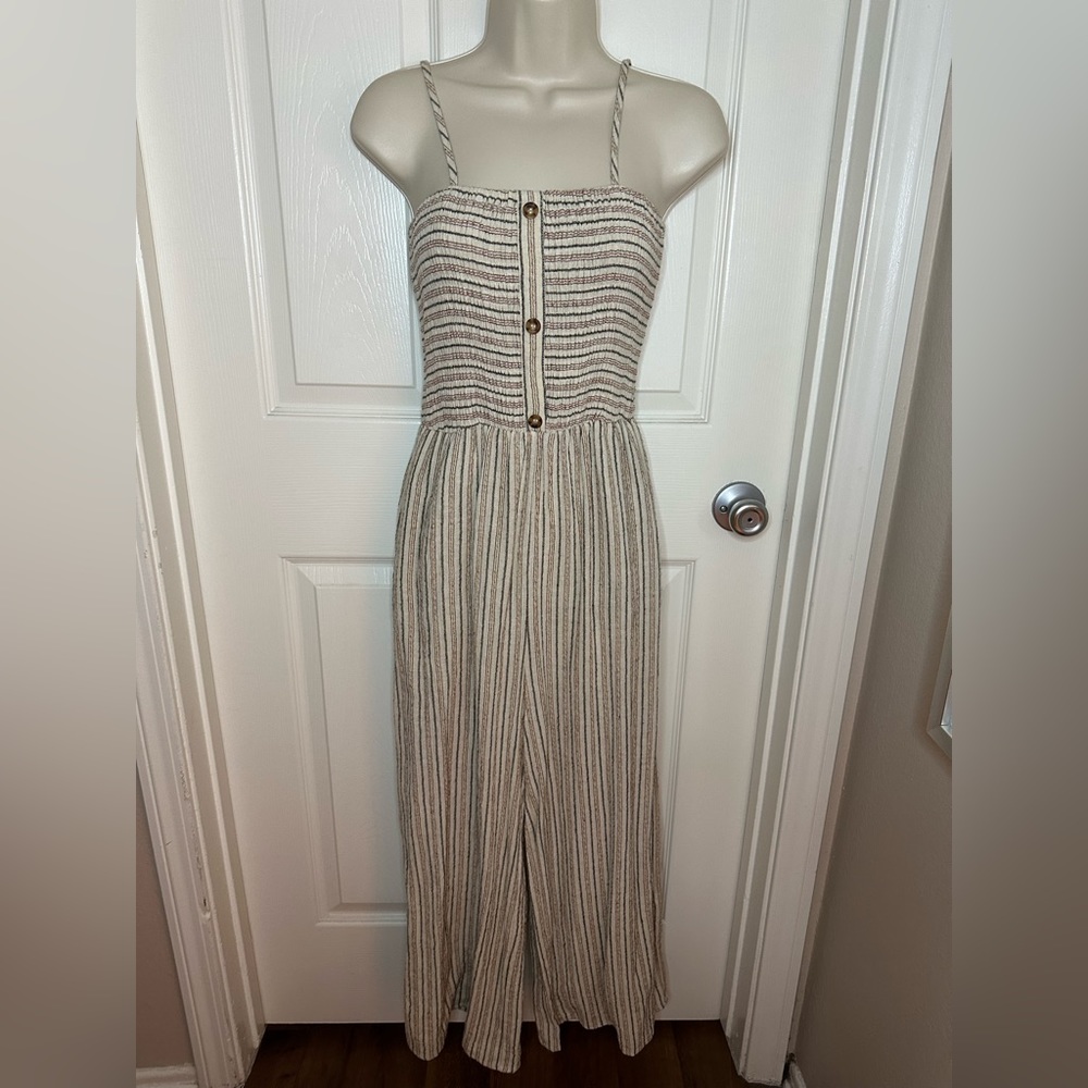 Beige/Cream romper with navy and red stripes.  Size small